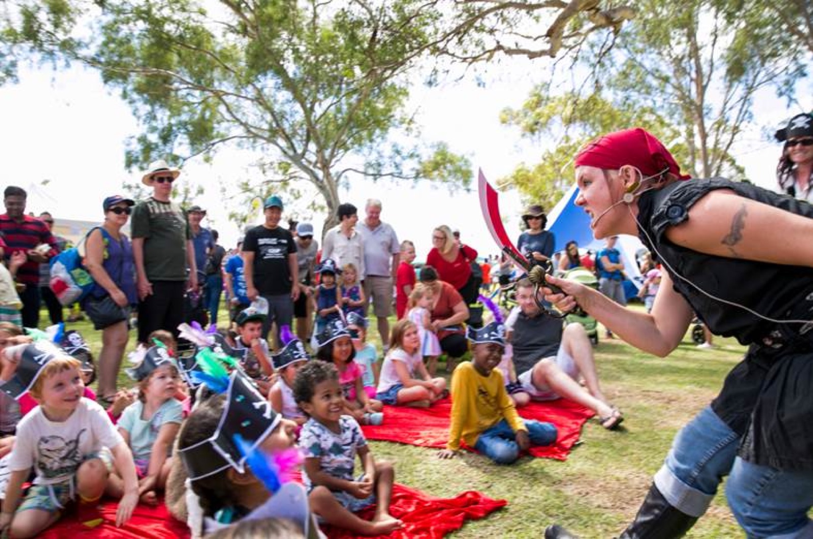 Artistic Disorder presenting pirate storytime to a group of children outdoors