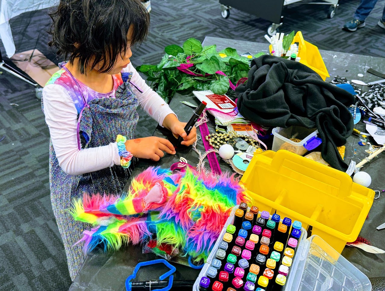 A child making a colourful costume
